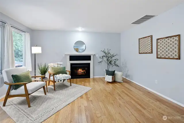 Family room features a cozy natural gas fireplace.