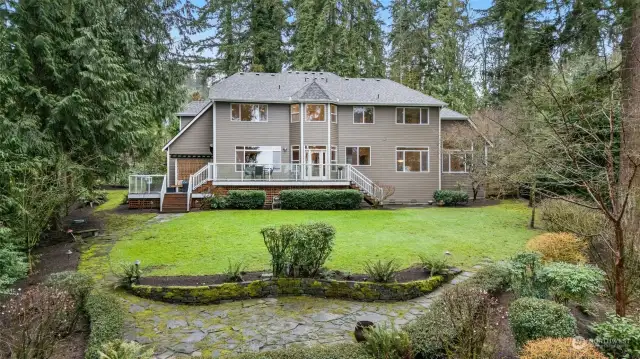 Large, level backyard with firepit area.