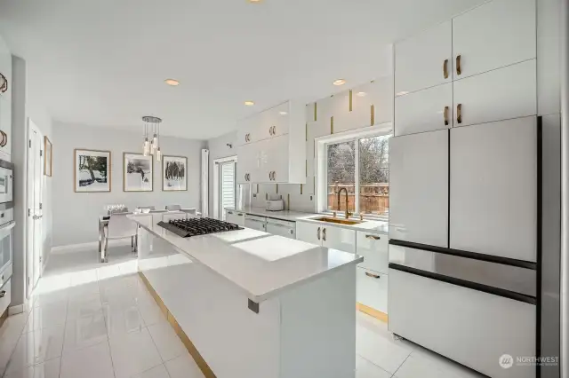 WOW - gorgeous and glamorous newly renovated kitchen with a massive center island, two dishwashers, built in oven & microwave, storage galore, and chic chic chic finishes throughout!