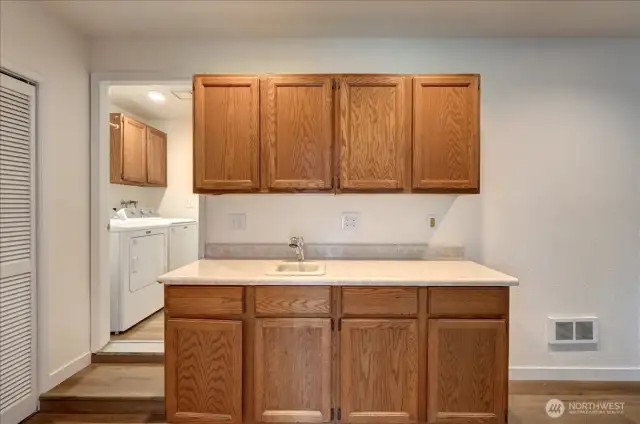 Garage was converted by a prior owner to an additional 4th bedroom, bar area and rec room. With the outside entrance - possible MIL?
