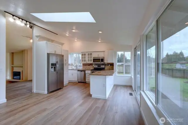 Speaking of natural light - kitchen/family room is flooded with new skylight and vaulted ceilings.