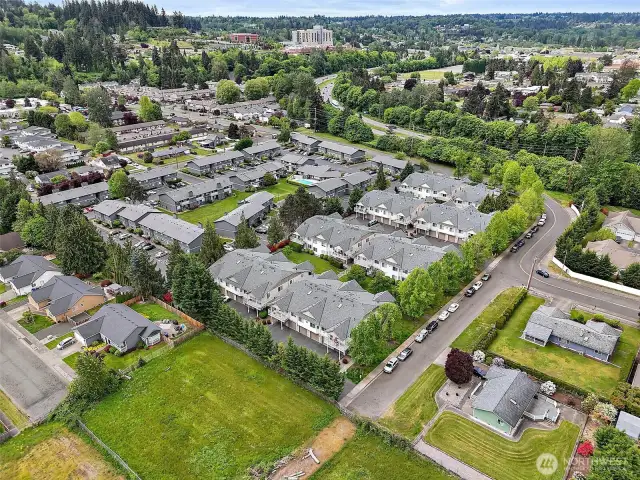 This aerial view showcases the unbeatable convenience and community appeal of this centrally located condo—nestled minutes from Good Samaritan Hospital, the Sounder train, freeway access, and all the charm of Downtown Puyallup. Surrounded by tree-lined streets and well-maintained homes in the desirable Puyallup School District, this is a rare opportunity for buyers seeking value, comfort, and accessibility in one of the area’s most sought-after neighborhoods.