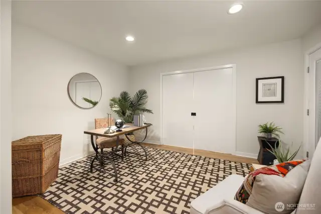 Next to the tv/den is a flex space that has been used as an office and music room. Through the doors there is the entry to the 3rd bedroom. Not shown is a door to the right that leads outside to deck!