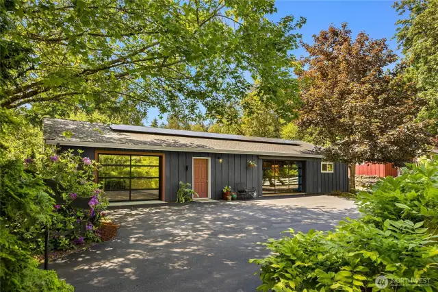 The carriage house is an amazing space. A large workshop/garage on the left there and then the interior is one big open space for a mulitude of uses.