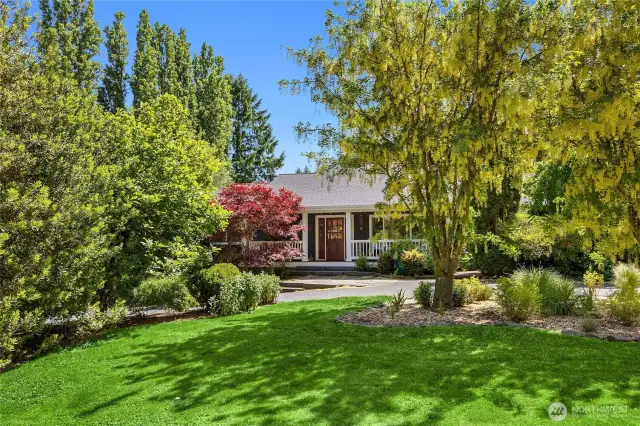 Tucked into the lush landscape is the 2300 sq ft all one level main home.