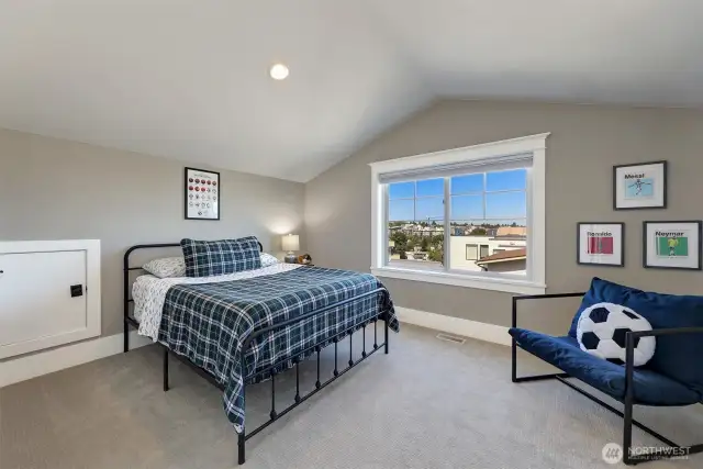 Fourth bedroom on the third floor.  There are some views of the Cascade Mountains.