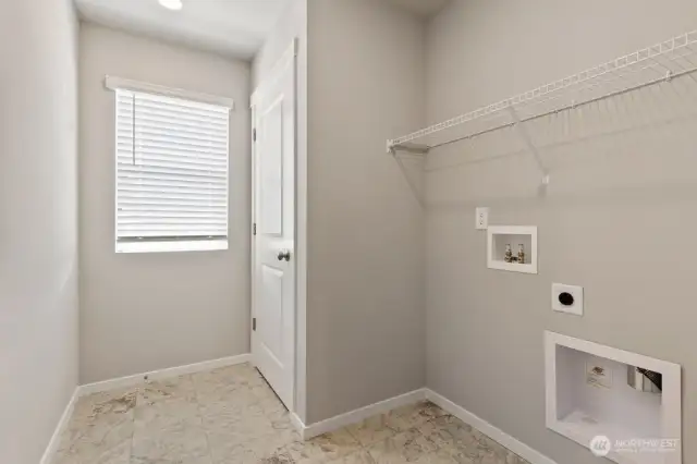 Convenient laundry room on upper level. Colors, finishes, and options will vary.