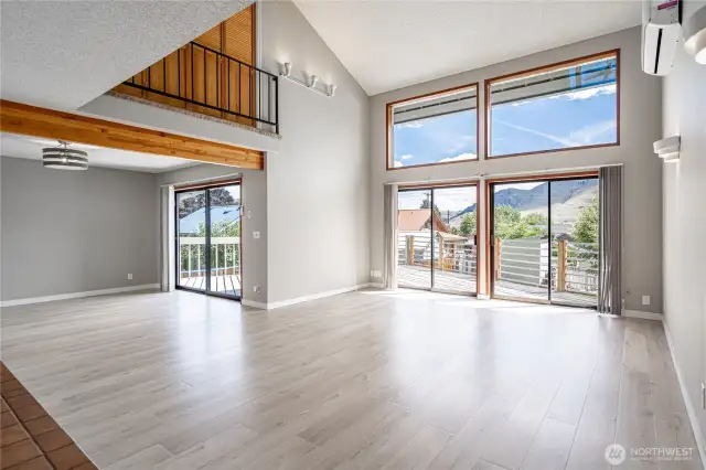 Living room enjoys vaulted ceilings