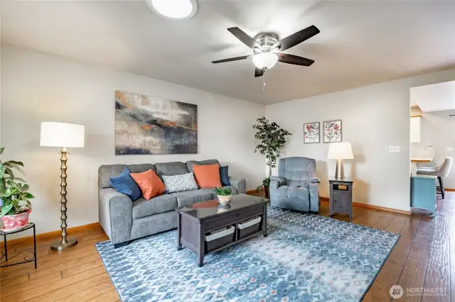 Living Room features skylight and large picture window that looks out to a covered front porch and rose garden
