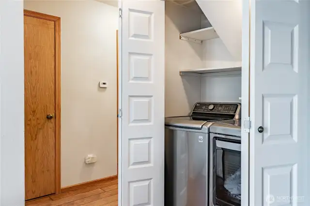 Laundry is tucked away behind double doors
