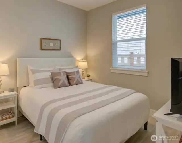 Queen size bed and large windows.