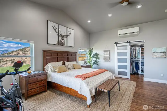 Primary bedroom with a walkin closet