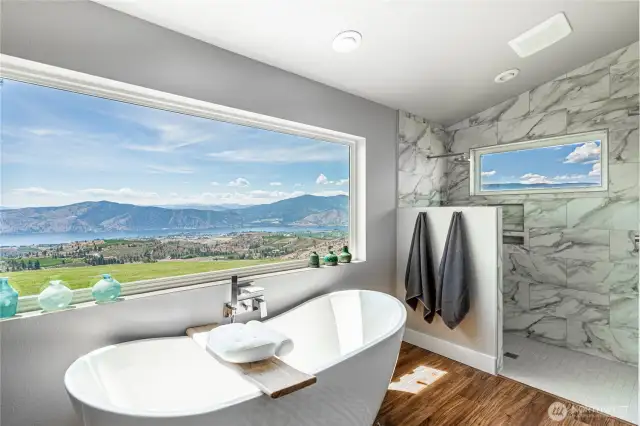 Walk in tiled shower and bath enjoys great daylight