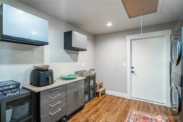 Laundry room with new stackable washer and dryer