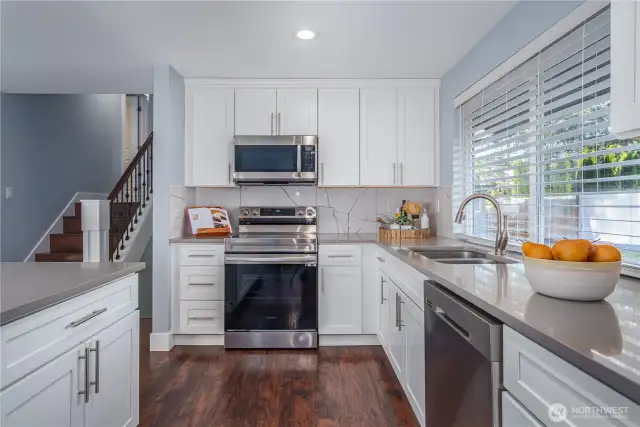 Expansive cabinetry provides ample storage. And most appliances are less than three years old.