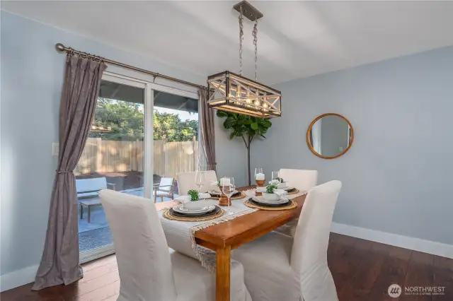 This dining area can be casual or elegant, with direct access to the patio and fully fenced backyard.