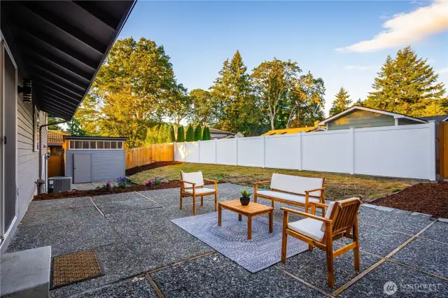 Multiple spaces for play, gardening, and entertaining begin with the upper patio off the dining room.