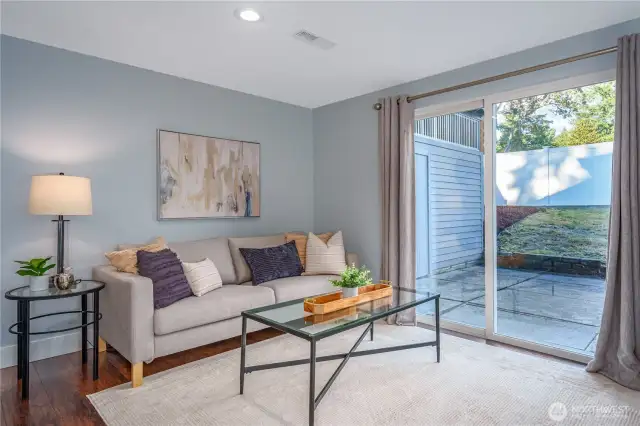 Sliding doors lead to the lower patio.