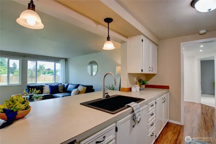 Kitchen open to the great room and peaceful view to the backyard and beyond.