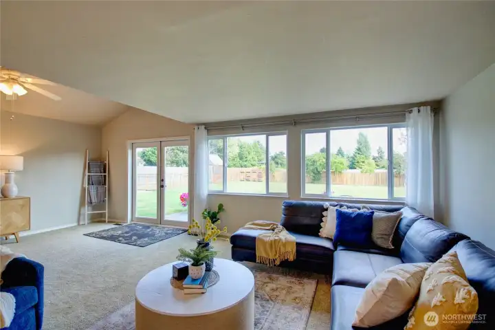 Spacious great room with lots of natural light, great view of backyard, foothills beyond.
