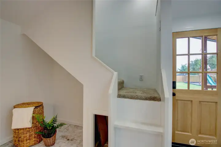 Laundry area near the primary bedroom and 3/4 bath.  Access to the back covered porch and yard.