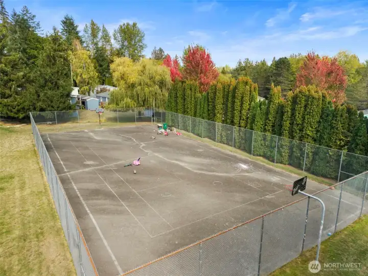 Community amenities include a basketball court and open recreation area, offering fun and activities within walking distance.