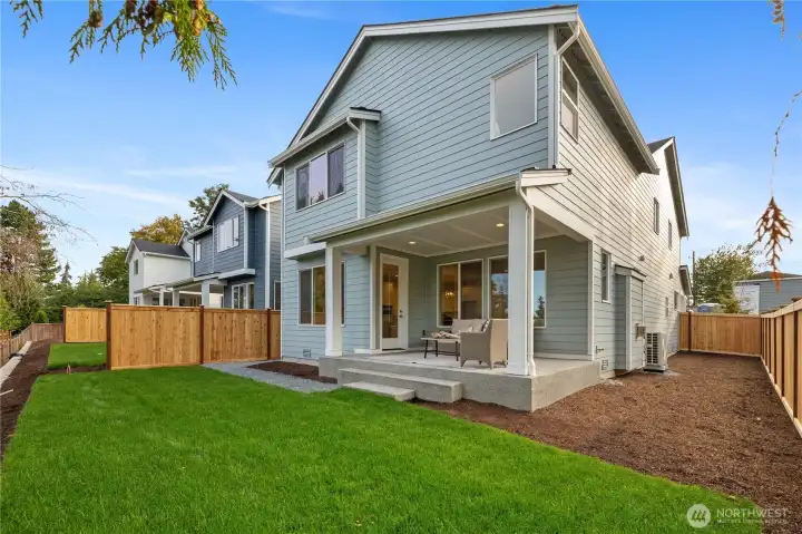 Fully fenced backyard with outdoor living area.