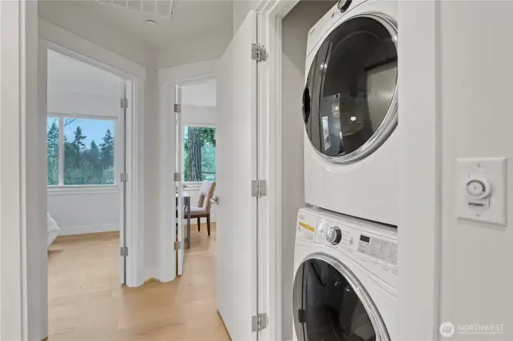 Conveniently located just outside the primary suite, the laundry closet features a full-sized washer and dryer.