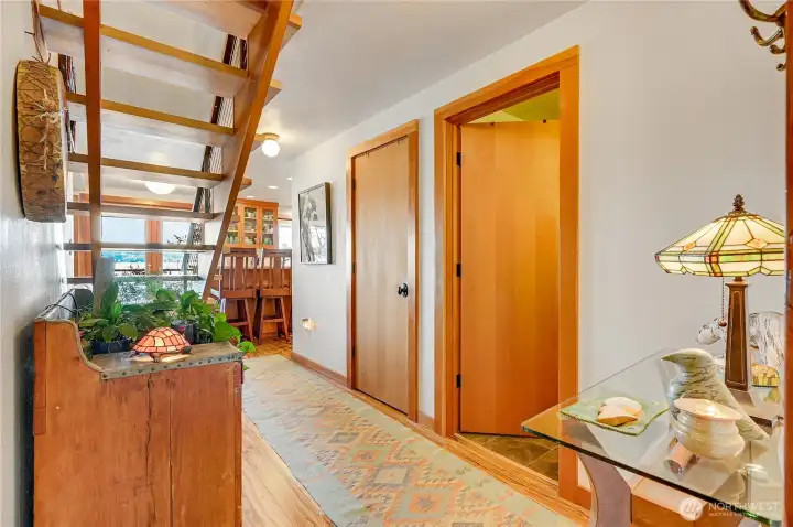 Front entry hall, guest bath and coat closet on right