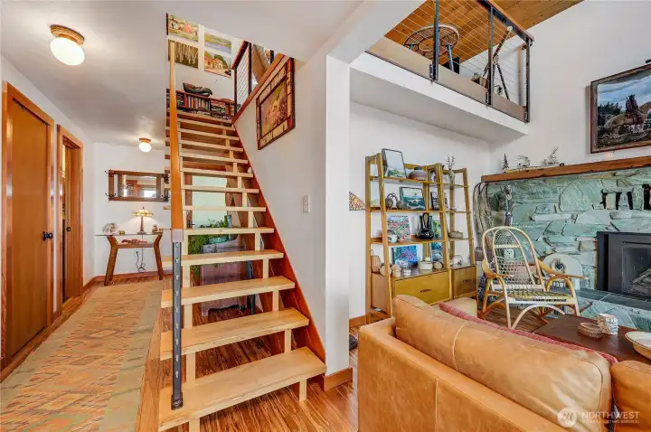 Front entry hall showing staircase to loft