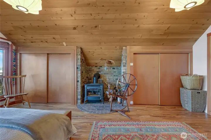 Primary bedroom Free standing stove and double closets