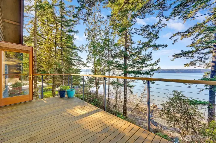 Primary bedroom deck, great spot for morning coffee, yoga, or a quiet hideway to read a book in the summer sun.
