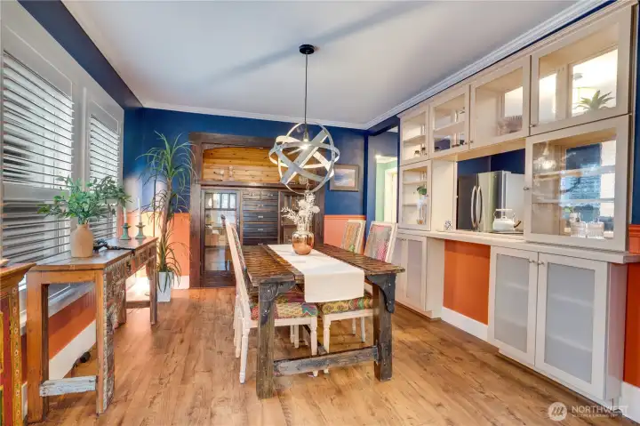 Notice how custom blinds and updated flooring complement original millwork and the distinctive built-in hutch.
