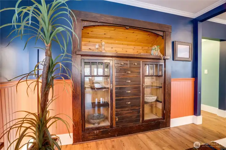 The original hutch is made for storing favorite dishes and treasures in the display cabinets, but also for tucking candles, sliverware, place mats, napkins, and other linens into the drawers.