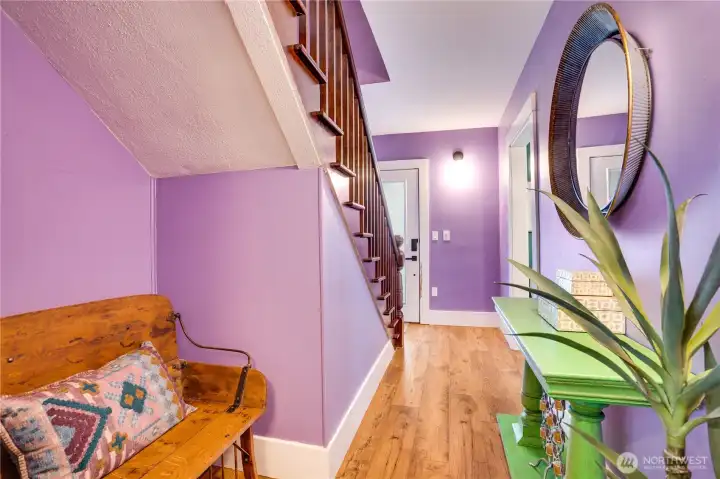 We're not quite ready to go all the way outside until we see the rest of the house. Speaking of rest, this nook under the stairs is the perfect spot to tuck a bench.