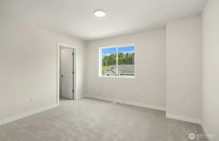 Bedroom upstairs Same design-different sold home.  Finishes vary.