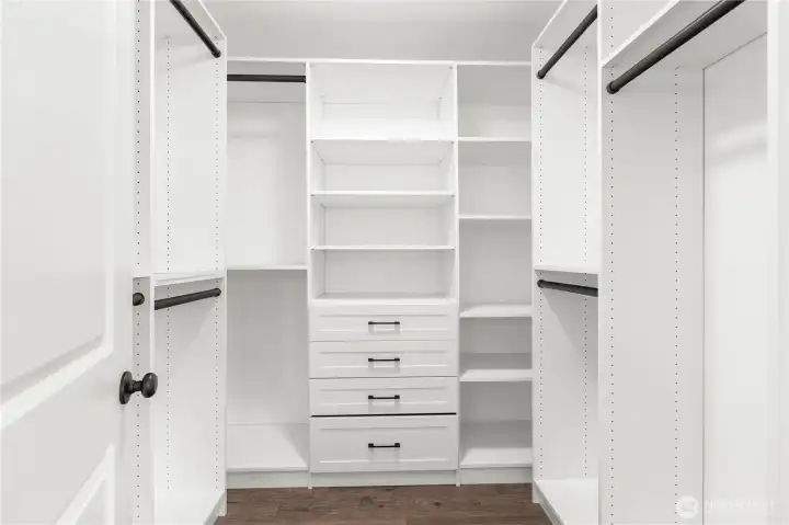 Beautiful walk in closet in primary with built-ins