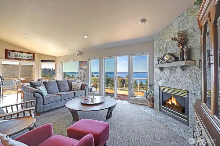 A pretty propane fireplace graces this awesome view Great Room!