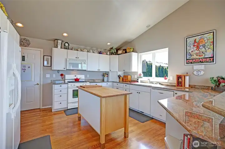 Light and bright kitchen with gas (propane) stove and pretty granite countertops ~