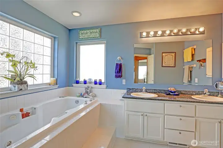 Main floor Owner's ensuite 5 piece bath includes a royal sized jetted tub~