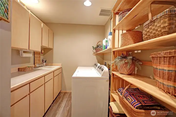 Huge laundry room with sin and tons of storage!