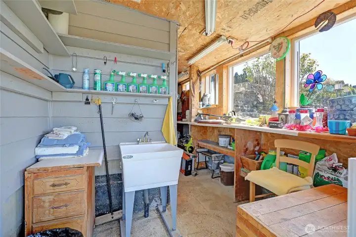 Enclosed potting and tool shed with sink!