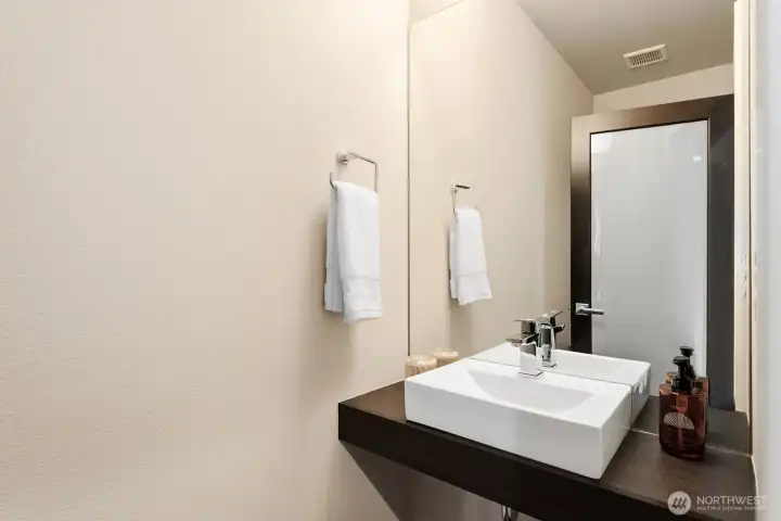 The powder room in the main hallway on the main floor.