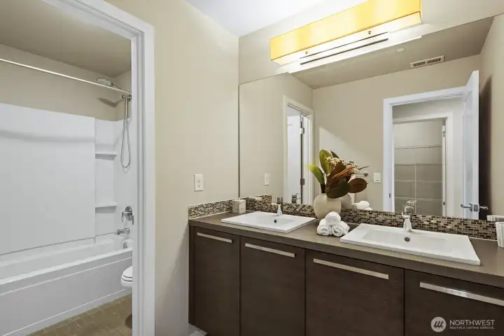 Main bath on the 2nd floor, centrally placed  by the 2 bedrooms and the large Bonus room on the 2nd floor.