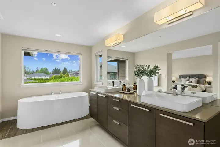 Another shot of the 2nd floor primary ensuite with large picture window overlooking private backyard