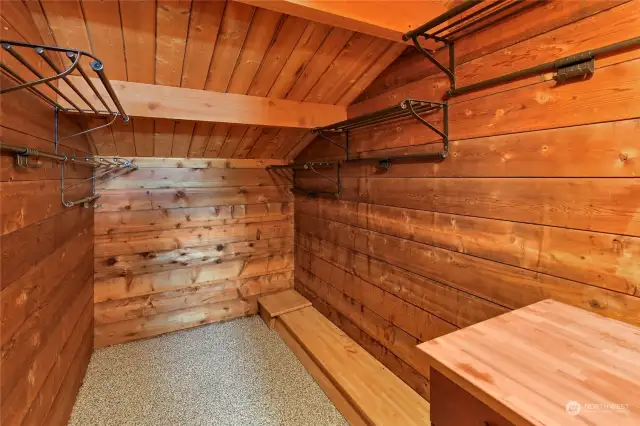 The laundry area opens to the primary bedroom walk-in cedar closet