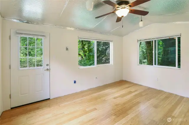 Studio interior is partially finished and features bamboo floors