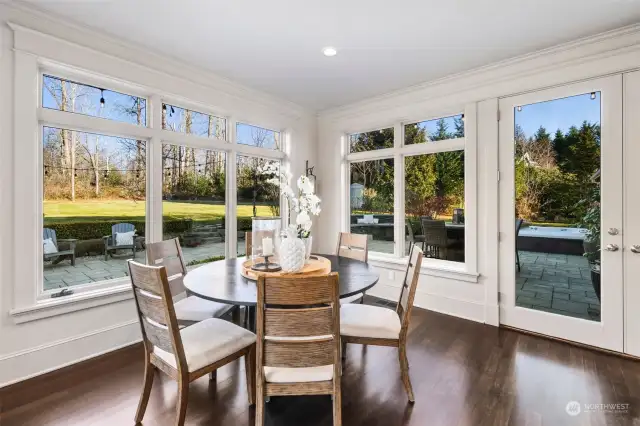 Kitchen Eating Nook Offers A Wall Of Windows And French Doors Allowing Views And Access To The Gorgeous Backyard.