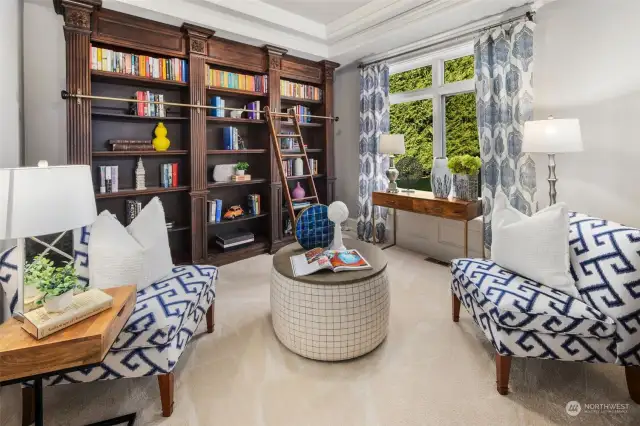 A Private Sitting Room - With Built-In Bookcase - Provides A Serene Retreat, ideal For Reading Or Relaxing By The Cozy Gas Fireplace.