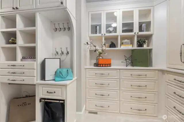 Two Spacious Walk-In Closets With Custom Closet Systems That Offer Ample Storage And Organization.